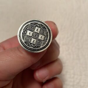 Vintage clip earrings. Silver toned button design. Circular with geometric print